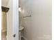 Cozy powder room features pedestal sink and neutral paint at 7518 Turley Ridge Ln, Charlotte, NC 28273