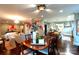 Open-concept dining area flowing into the kitchen, with hardwood floors and stylish decor at 802 E Franklin St, Monroe, NC 28112