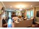 Spacious living room featuring a fireplace, chandelier, and comfortable seating arrangements at 802 E Franklin St, Monroe, NC 28112