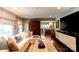 Inviting living room showcasing hardwood floors, modern decor, and seamless kitchen access at 802 E Franklin St, Monroe, NC 28112