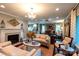 Elegant living room with fireplace, chandelier, and comfortable seating area at 802 E Franklin St, Monroe, NC 28112