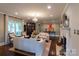 Comfortable living room with a fireplace, large windows, and stylish furnishings at 802 E Franklin St, Monroe, NC 28112