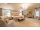 Spacious main bedroom with a chandelier, neutral decor, and natural light at 802 E Franklin St, Monroe, NC 28112