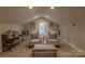Cozy sitting room featuring natural light, neutral tones, and comfortable seating arrangements at 802 E Franklin St, Monroe, NC 28112