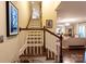 Beautiful staircase showcasing hardwood steps, white railings, and natural light, leading to the upper level at 802 E Franklin St, Monroe, NC 28112