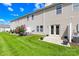 A spacious backyard with lush green grass and a small patio at 921 Summerlake Dr, Fort Mill, SC 29715