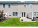 A green backyard with a small patio and air conditioning equipment at 921 Summerlake Dr, Fort Mill, SC 29715