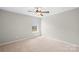 Bright bedroom with neutral carpet, a window, and ceiling fan at 921 Summerlake Dr, Fort Mill, SC 29715