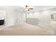 Spacious bonus room with neutral carpet, ceiling fan and lots of natural light at 921 Summerlake Dr, Fort Mill, SC 29715