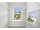 Walk-in closet with built-in shelving and a window at 921 Summerlake Dr, Fort Mill, SC 29715