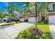 Townhome with an attached two-car garage and neat landscaping at 921 Summerlake Dr, Fort Mill, SC 29715