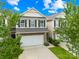 Charming townhome featuring stone accents, attached garage and manicured landscaping at 921 Summerlake Dr, Fort Mill, SC 29715