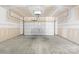 Spacious two-car garage featuring a sealed concrete floor at 921 Summerlake Dr, Fort Mill, SC 29715