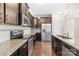 Modern kitchen featuring stainless steel appliances, granite countertops and dark cabinetry at 921 Summerlake Dr, Fort Mill, SC 29715