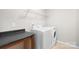 Bright laundry room includes new washer and dryer, and folding table at 921 Summerlake Dr, Fort Mill, SC 29715