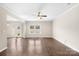Sunlit living room featuring hardwood floors, neutral paint, and access to a backyard patio at 921 Summerlake Dr, Fort Mill, SC 29715