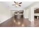Spacious living room featuring hardwood floors, an open layout, and access to the kitchen at 921 Summerlake Dr, Fort Mill, SC 29715