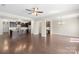 Open-concept living space showcasing hardwood floors and seamless flow to the modern kitchen at 921 Summerlake Dr, Fort Mill, SC 29715