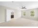 Large primary bedroom with connecting bathroom and neutral carpet at 921 Summerlake Dr, Fort Mill, SC 29715