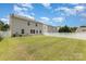 Spacious backyard with a well-maintained lawn and a white fence, perfect for outdoor activities and privacy at 9416 Cotton Gum Rd, Charlotte, NC 28227