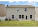 Spacious backyard with green grass and siding exterior at 9416 Cotton Gum Rd, Charlotte, NC 28227