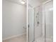 Clean bathroom featuring tiled floor, a toilet, and a glass-enclosed walk-in shower at 9416 Cotton Gum Rd, Charlotte, NC 28227
