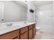 Bathroom features a double vanity with laminate countertop and tub and shower at 9416 Cotton Gum Rd, Charlotte, NC 28227