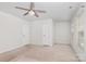 Bedroom with carpet, ceiling fan, and two doors at 9416 Cotton Gum Rd, Charlotte, NC 28227