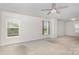 Spacious main bedroom with neutral walls, carpet and several windows for natural light at 9416 Cotton Gum Rd, Charlotte, NC 28227