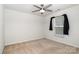 Simple bedroom with carpet, ceiling fan, and window at 9416 Cotton Gum Rd, Charlotte, NC 28227