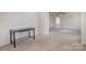 Neutral colored bedroom with carpet and desk at 9416 Cotton Gum Rd, Charlotte, NC 28227