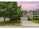 Charming two-story home with a well-manicured lawn and a spacious driveway at 9416 Cotton Gum Rd, Charlotte, NC 28227