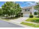 Charming two-story home with a well-manicured lawn and a spacious driveway at 9416 Cotton Gum Rd, Charlotte, NC 28227