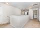Carpeted hallway with white railing, and laundry room at 9416 Cotton Gum Rd, Charlotte, NC 28227