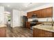 Stylish kitchen featuring granite countertops, stainless steel appliances, and wood floors at 9416 Cotton Gum Rd, Charlotte, NC 28227