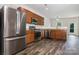 Modern kitchen with stainless steel appliances and wood floors at 9416 Cotton Gum Rd, Charlotte, NC 28227