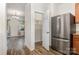 Bright kitchen featuring stainless steel refrigerator and pantry at 9416 Cotton Gum Rd, Charlotte, NC 28227