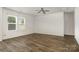 Bright living room with modern ceiling fan and lots of natural light at 9416 Cotton Gum Rd, Charlotte, NC 28227