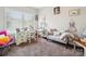Bedroom featuring a desk and decorative chair, with a sofa and light-blocking blinds at 9428 Carneros Creek Rd, Charlotte, NC 28214
