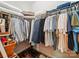 A walk-in closet with lots of space for shoes and hanging clothes is displayed in the image at 9428 Carneros Creek Rd, Charlotte, NC 28214