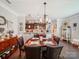 Charming dining room featuring an elegant chandelier and comfortable seating for memorable gatherings at 9428 Carneros Creek Rd, Charlotte, NC 28214