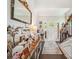 Welcoming foyer featuring elegant decor, a staircase, and an abundance of natural light, perfect for guests at 9428 Carneros Creek Rd, Charlotte, NC 28214
