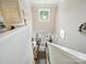A high angle view shows the foyer with a dark wood floor and lots of natural light at 9428 Carneros Creek Rd, Charlotte, NC 28214