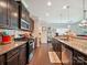 Modern kitchen with granite countertops, stainless steel appliances, and ample cabinet space for storage at 9428 Carneros Creek Rd, Charlotte, NC 28214