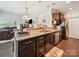 Well-equipped kitchen featuring a breakfast bar, granite countertops, and a seamless flow to the living area at 9428 Carneros Creek Rd, Charlotte, NC 28214
