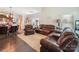 Open-concept living space flowing into the dining area, featuring comfortable seating and ample natural light at 9428 Carneros Creek Rd, Charlotte, NC 28214