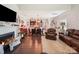 Inviting living room with a fireplace, comfortable seating, and an open view to the dining and kitchen areas at 9428 Carneros Creek Rd, Charlotte, NC 28214