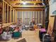 Unfinished room with exposed beams, framing, and stored seasonal decorations at 9428 Carneros Creek Rd, Charlotte, NC 28214