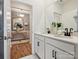 Modern bathroom featuring double vanity, framed mirror, and modern fixtures at 1070 Bull Dog Ln, Wingate, NC 28174