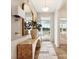 Inviting entryway featuring wood floors, stylish console table, and view of the outdoors at 1070 Bull Dog Ln, Wingate, NC 28174